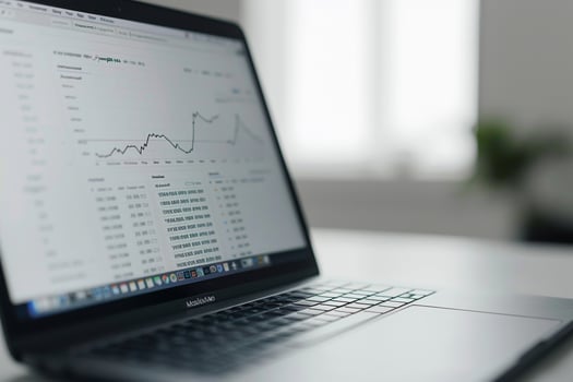 Laptop Mockup with Financial Charts on photo