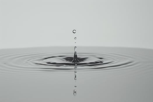 Water Droplet Creating Ripples on White Surface   Background Nature photo