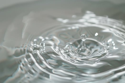 Water Droplet Creating Ripples on White Surface   Background Nature photo