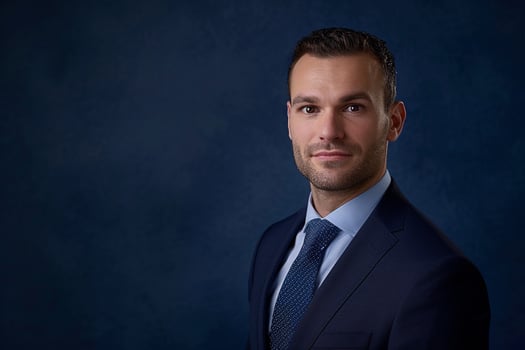 Head of a businessman in a classic navy Background projecting confidence photo