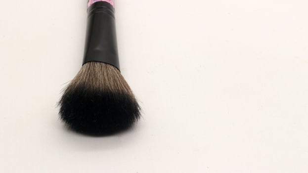 Close up blush brush for makeup isolated photo