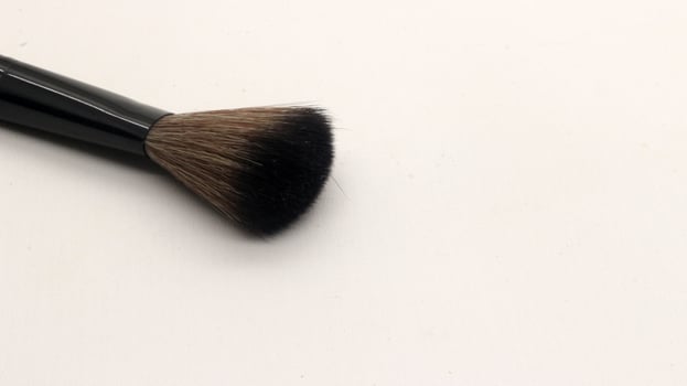 Close up blush brush for makeup isolated photo