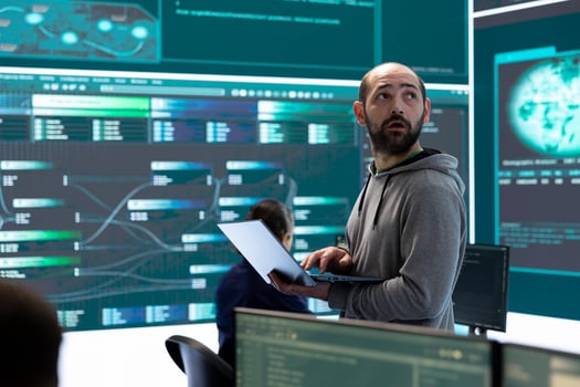 Hackers team engaging in governmental espionage and using phishing techniques for illegal access to data, working on national security breach. Spyware agency gains access on a big screen. photo