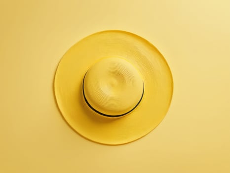 yellow beach hat isolated on yellow background. photo