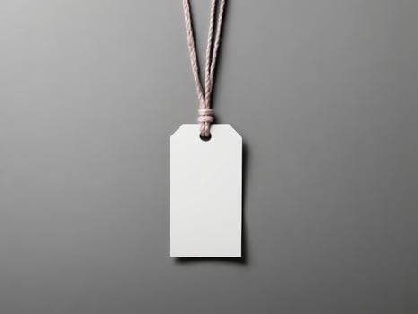 White Paper Price Label With String Isolated on gray background. photo