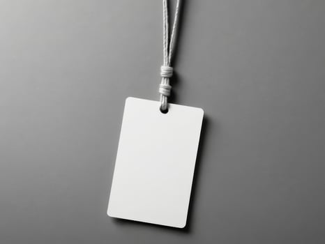 White Paper Price Label With String Isolated on gray background. photo