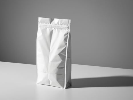 White paper doypack placed on podium on empty background. photo