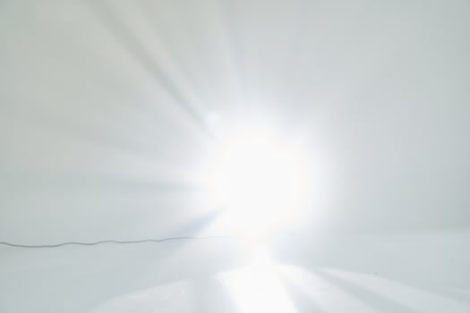 The light effect is a flash. A light beam in the room, a bright flash. With space to copy, overlay for your design photo