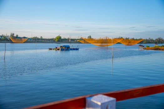 landscape of life and houses next to Thu Bon river in Hoi An ancient town, Quang Nam Province, Vietnam. Hoi An is one of the most popular destinations in Vietnam. photo