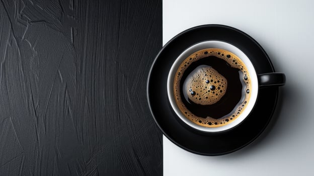Top View of a Black Coffee Cup on a Black and White Background with Textured Surface photo