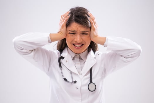 Portrait of anxious doctor who is exhausted. photo