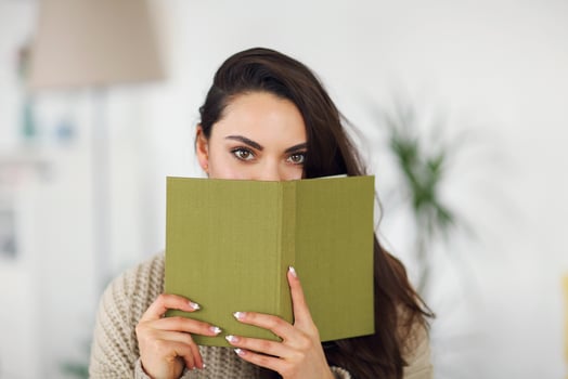 Young happy brunette woman with book photo