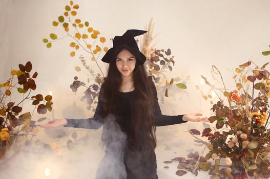 Young witch looking at camera photo