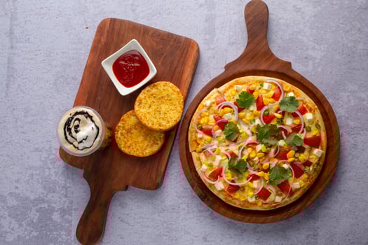 Delicious Vegetarian Pizza Top Shot With Garlic Bread, Ketchup and Milk Shake photo