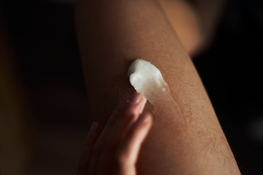 Body skin care concept. Moisturizer after hot water taking bathroom shower photo
