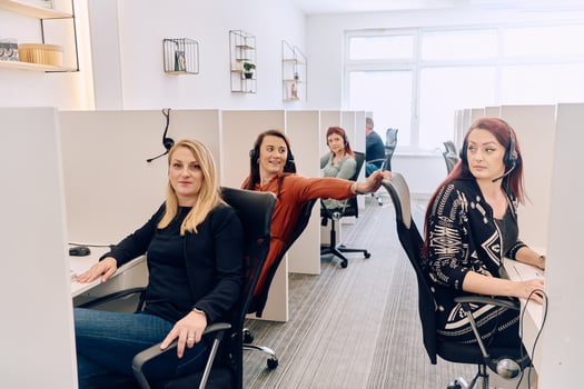Team of Women Providing Customer Support in Call Center Environment. photo