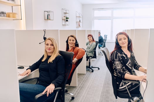 Team of Women Providing Customer Support in Call Center Environment. photo