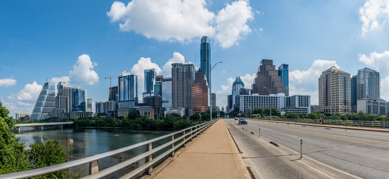 Panorama of modern apartment buildings and offices by the Colorado River in cityscape skyline from South Congress bridge in Austin Texas photo