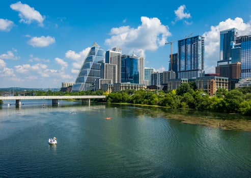 Modern apartment buildings and offices by the Colorado River in cityscape skyline of Austin Texas photo