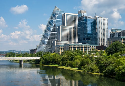 Modern apartment buildings and offices by the Colorado River in cityscape skyline of Austin Texas photo