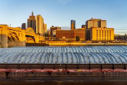 Early morning cityscape of St Paul Minnesota and Mississippi river with docked dry cargo barges photo