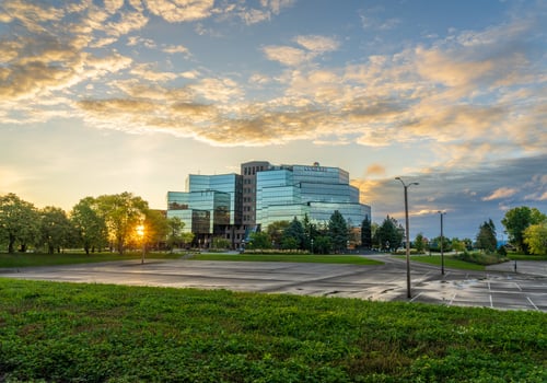 St Paul, MN - 14 October 2023. Sunrise behind Comcast offices on River Park Plaza in Minnesota photo