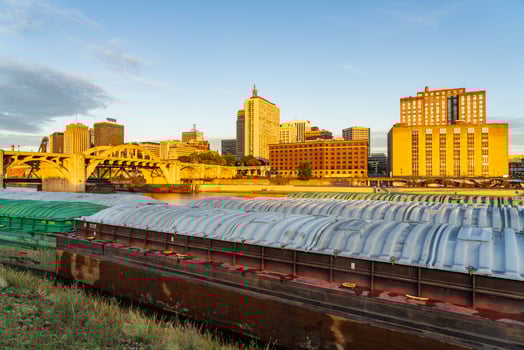 St Paul, MN - 14 October 2023. Early morning cityscape in Minnesota by Mississippi river with docked dry cargo barges photo