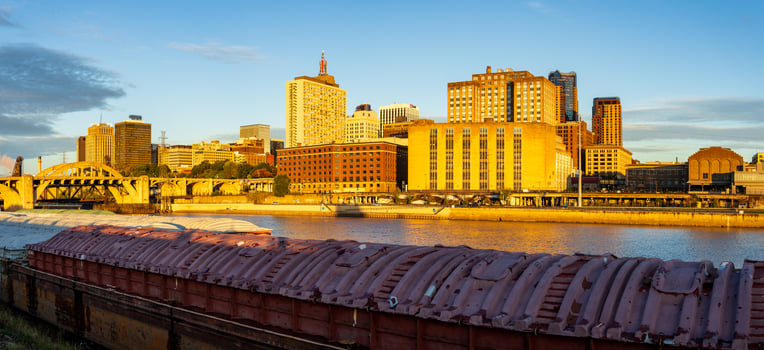 St Paul, MN - 14 October 2023. Early morning cityscape in Minnesota by Mississippi river with docked dry cargo barges photo