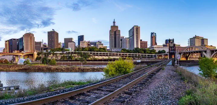St Paul, MN - 14 October 2023. Early morning cityscape of Twin Cities in Minnesota and Mississippi river with railroad bridge photo