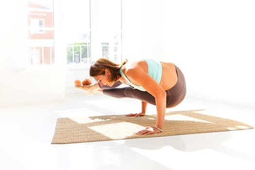 Flexible woman doing yoga at home photo