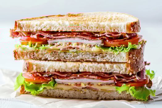 Double-Decker Sandwich with Roast Beef, Cheese, Tomato, and Lettuce photo