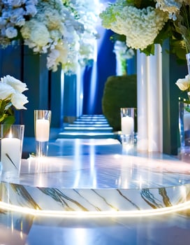 White marble podium with white flowers and candles photo