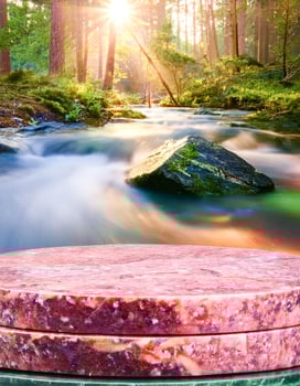 Marble Tabletop in Forest Stream Scene photo