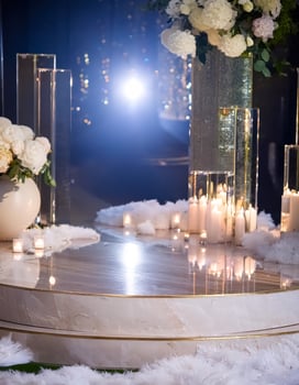Elegant Wedding Ceremony Setup with White Flowers, Candles, and Feathers photo