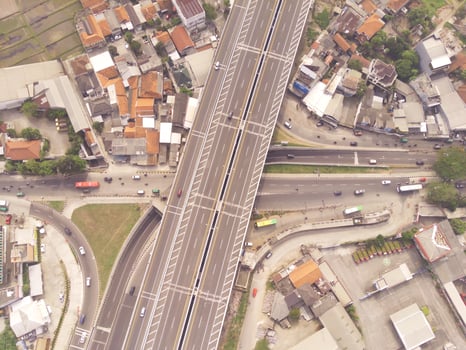 Bird eye view of Multiple vehicle lanes on Purbaleunyi Toll, Indonesia. Transportation Industry. Panoramic Landscape. Graphic Resources. Drones Point of view. Aerial Landscape Photography Concept photo