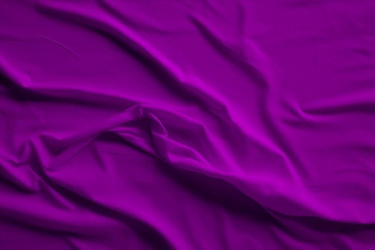 Purple silk fabric with folds and folds photo