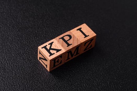 Inscription KPI Key Performance Indicator with wooden cubes photo