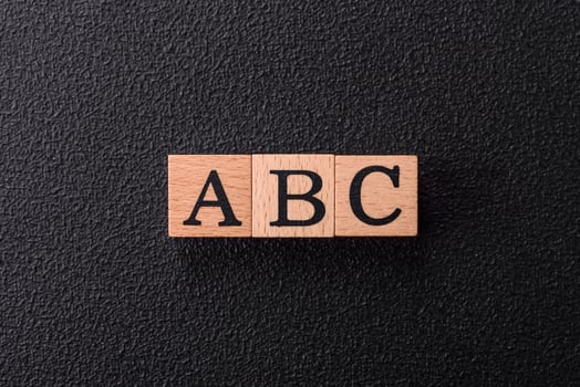Inscription ABC wooden cubes, conceptual business background photo