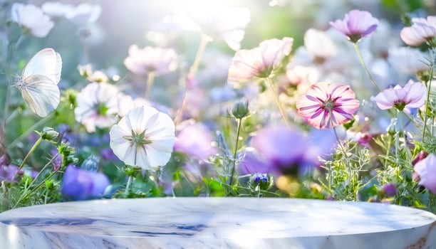 Marble podium with blurred background of flowers and butterfly photo
