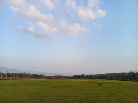 photo of a field where you can practice hitting golf balls, usually called a driving range