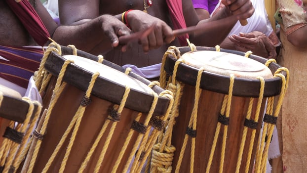 Artists playing Chenda, a South Indian traditional musical instrument photo