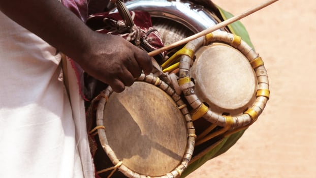 An artists playing twin drum, a South Indian traditional musical instrument photo