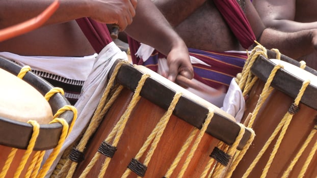 Artists playing Chenda, a South Indian traditional musical instrument photo