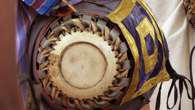 An artists playing Maddalam, a South Indian traditional musical instrument photo