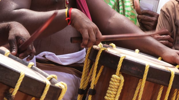 Artists playing Chenda, a South Indian traditional musical instrument photo