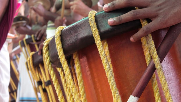 Artists playing Chenda, a South Indian traditional musical instrument photo