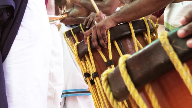 Artists playing Chenda, a South Indian traditional musical instrument photo