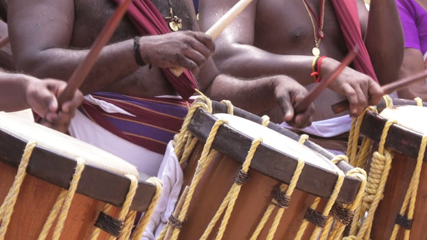 Artists playing Chenda, a South Indian traditional musical instrument photo