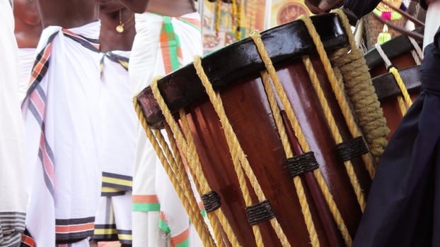 Artists playing Chenda, a South Indian traditional musical instrument photo