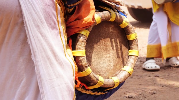 An artist playing Thavil, a South Indian traditional musical instrument photo